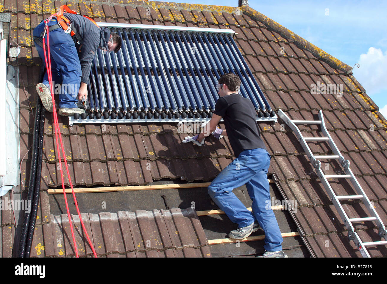 Two engineers installing solar panels hi-res stock photography and ...