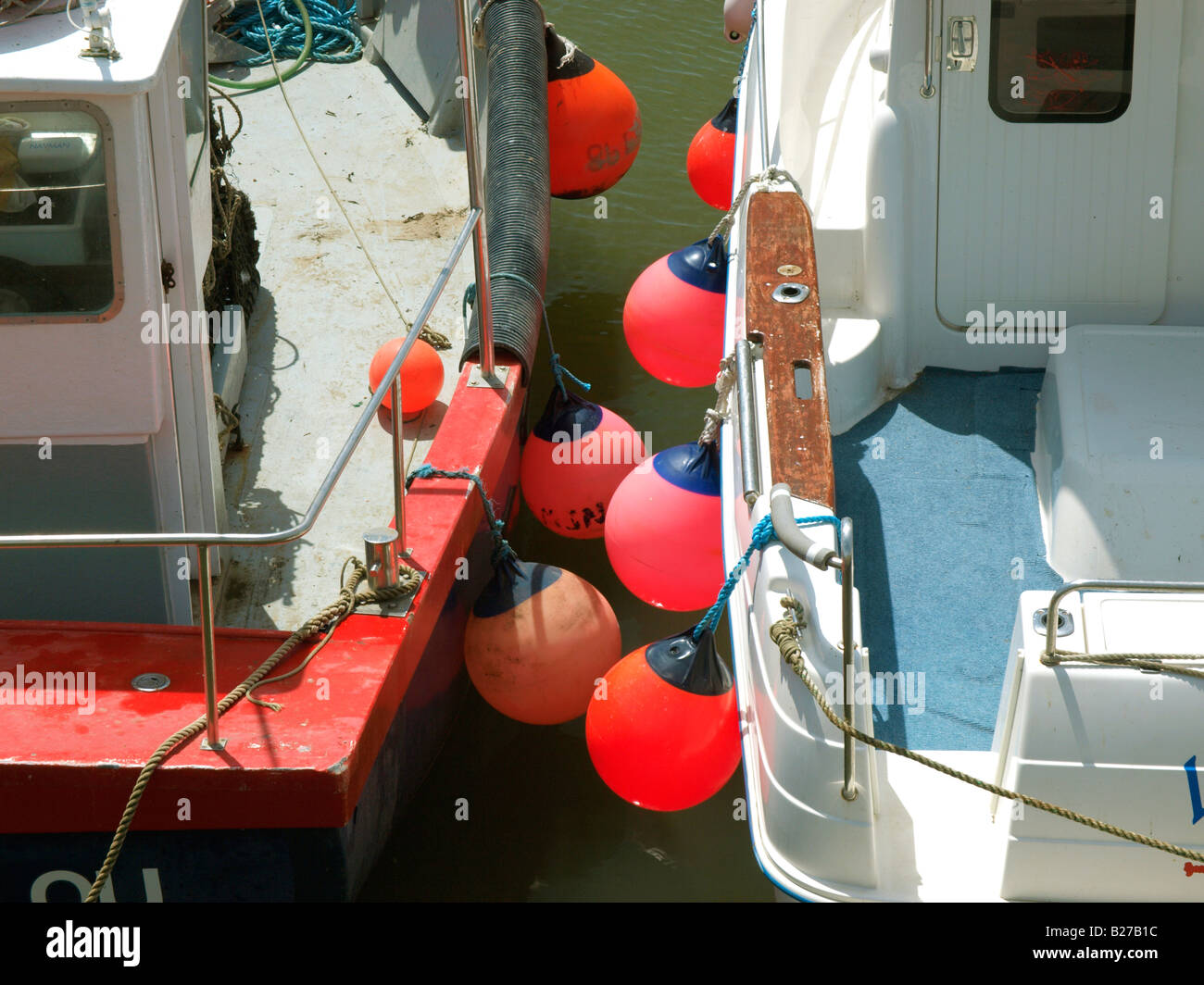 Colourful fenders on side of fishing boat Stock Photo Alamy