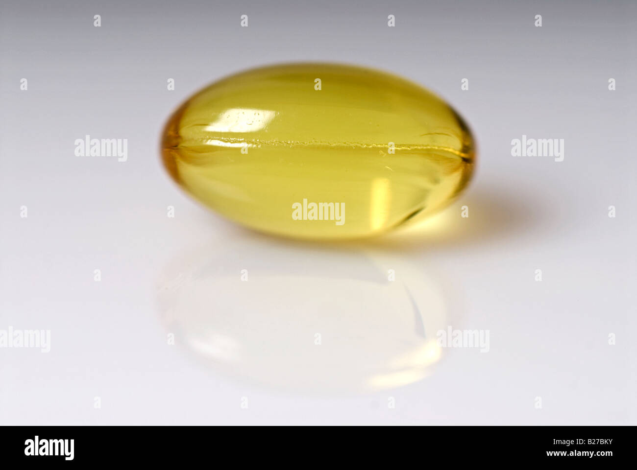Stock photo of a Vitamin E yellow capsule These capsules are a natural