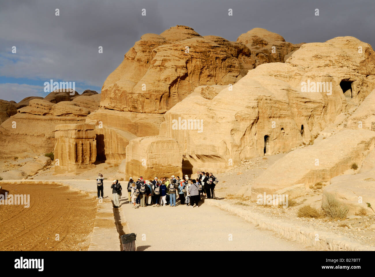 Djin Blocks with tourists, Nabataean ancient town Petra, Jordan, Arabia Stock Photo