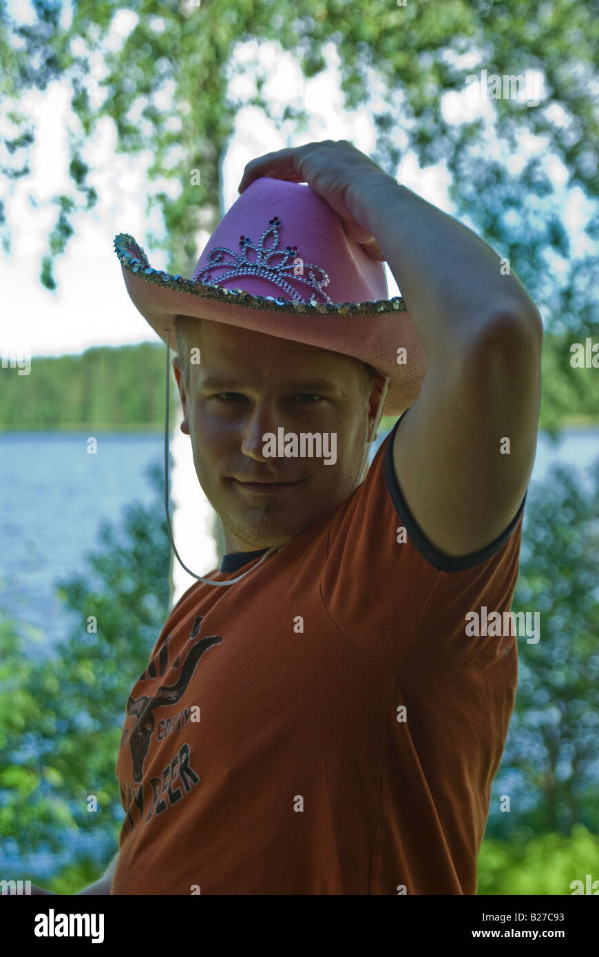 Salutation by a cowboy with a pink stetson hat Stock Photo