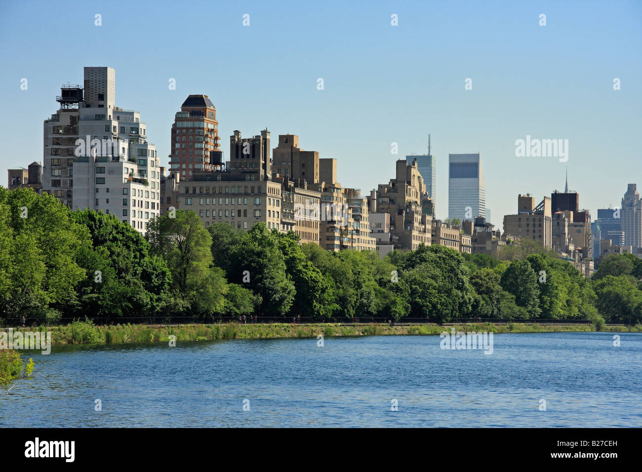Central Park reservoir and upper east Manhattan skyline - New York City, USA Stock Photo