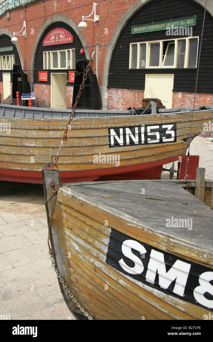 City of Brighton and Hove, England. Boats from the Brighton Fishing Museum in the King’s Road Arches on Brighton Beach. Stock Photo
