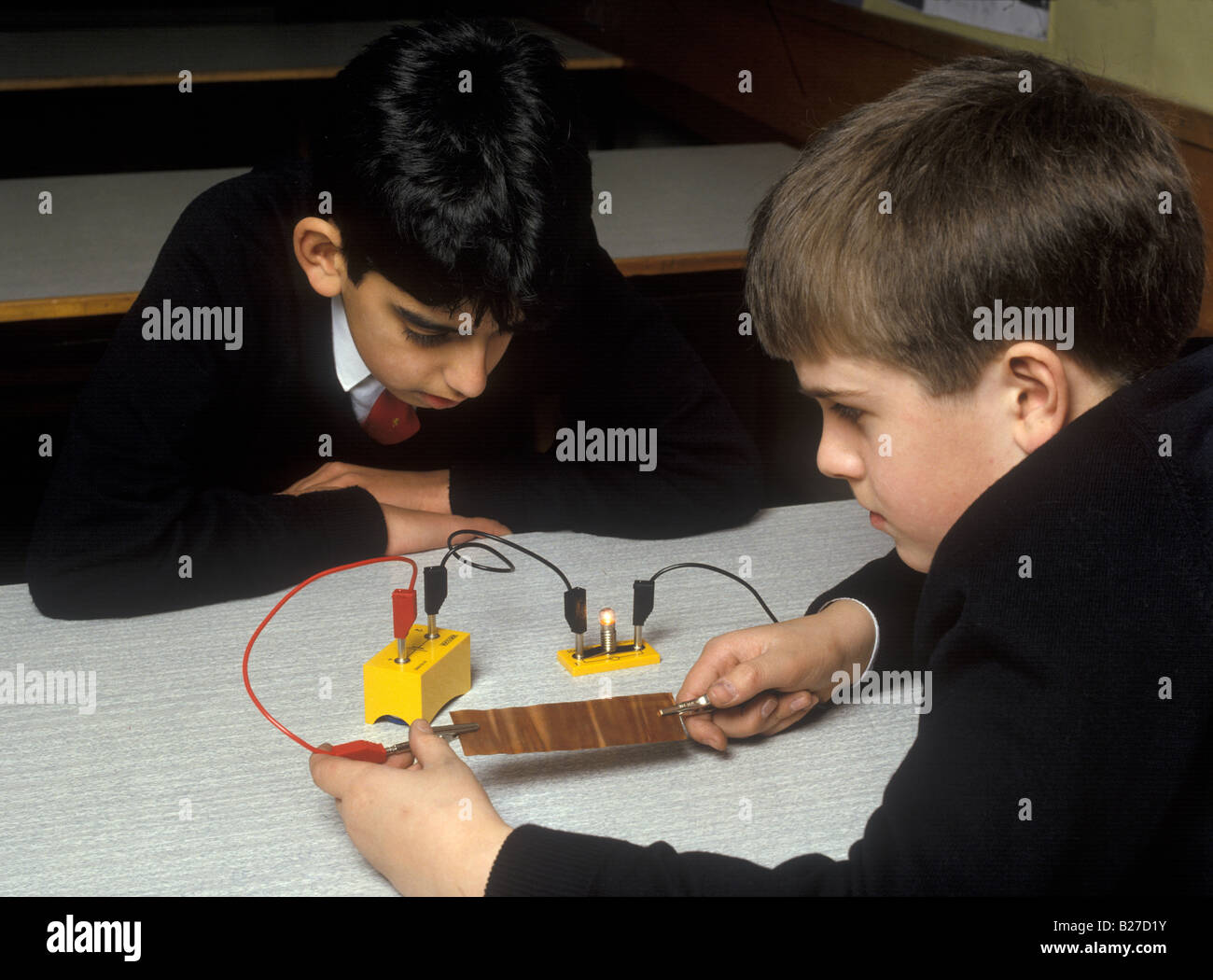 boys testing electrical conductivity of copper Stock Photo Alamy