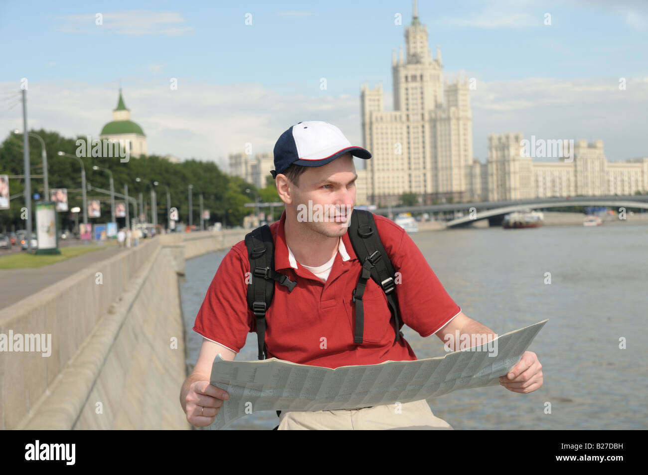 Tourist with map at the embankment of Moscow river, Moscow, Russia Stock Photo