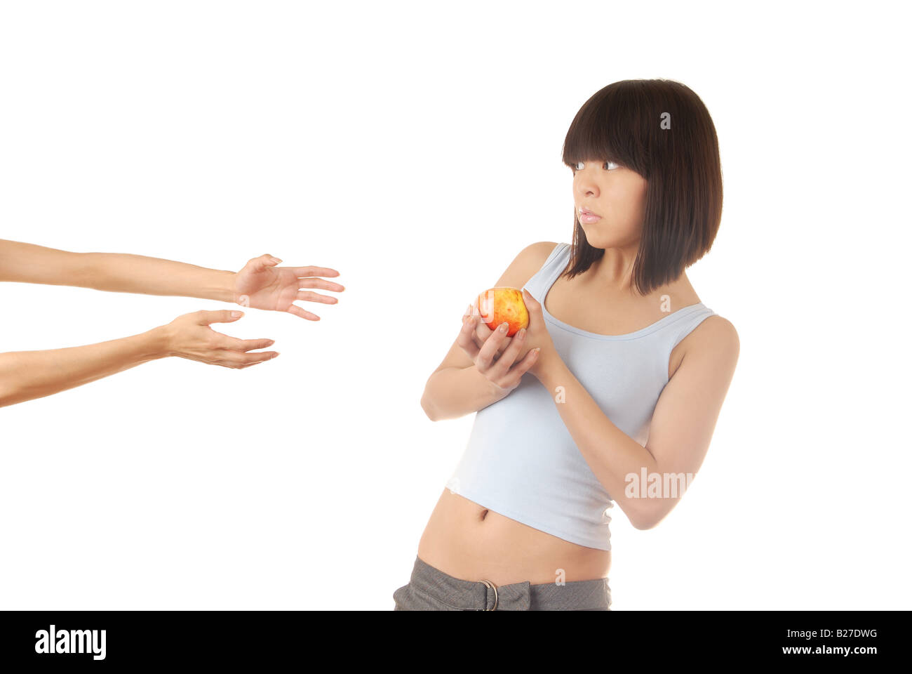 Young lady with apple and two hands asking to help Stock Photo