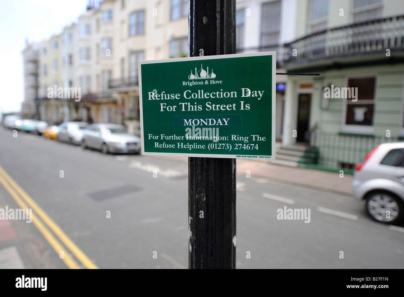 Brighton City Council fit new signs to inform residents of the rubbish collection day to reduce bin numbers on the kerbside. Stock Photo