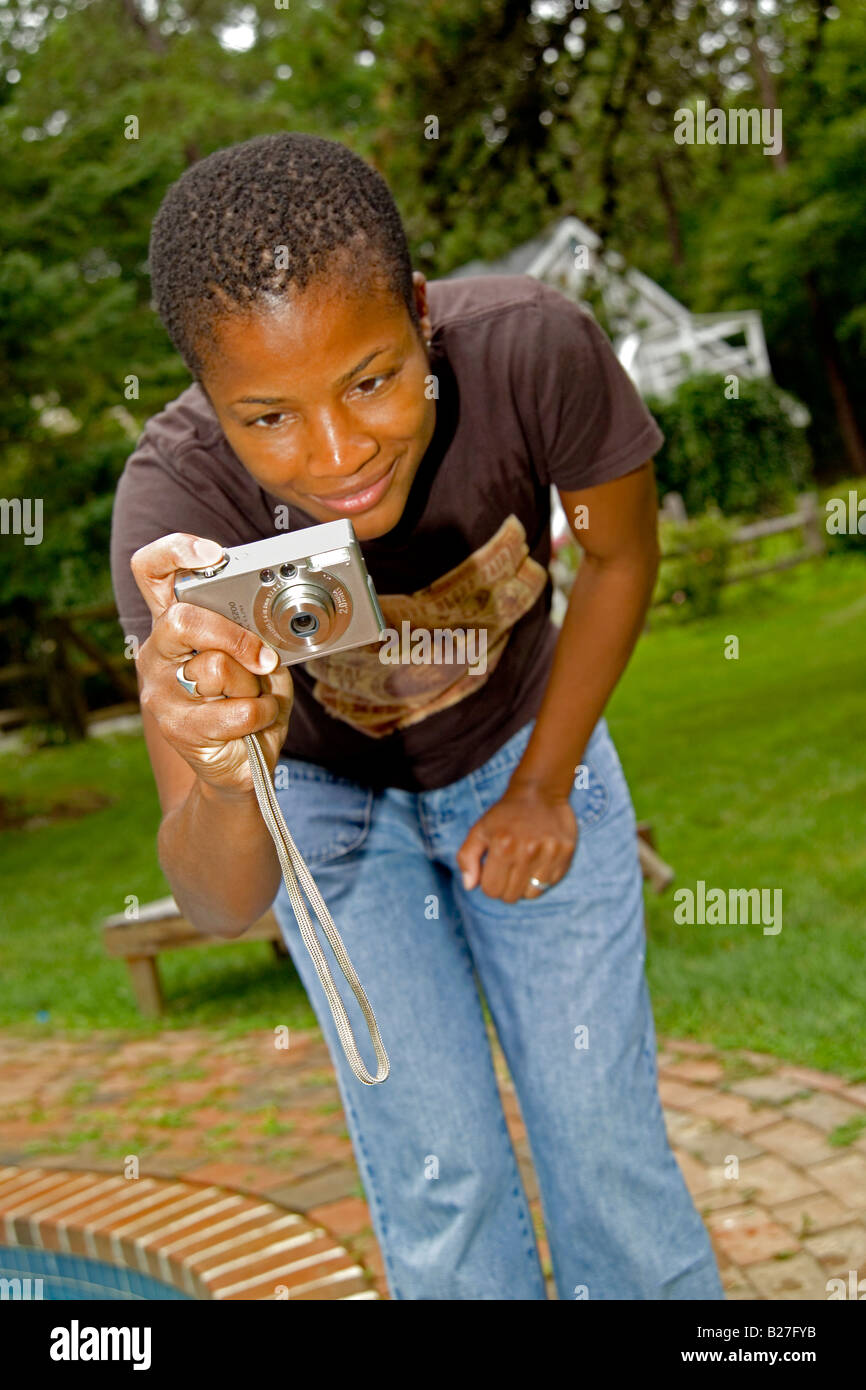 black woman African American taking picture vertical Stock Photo - Alamy
