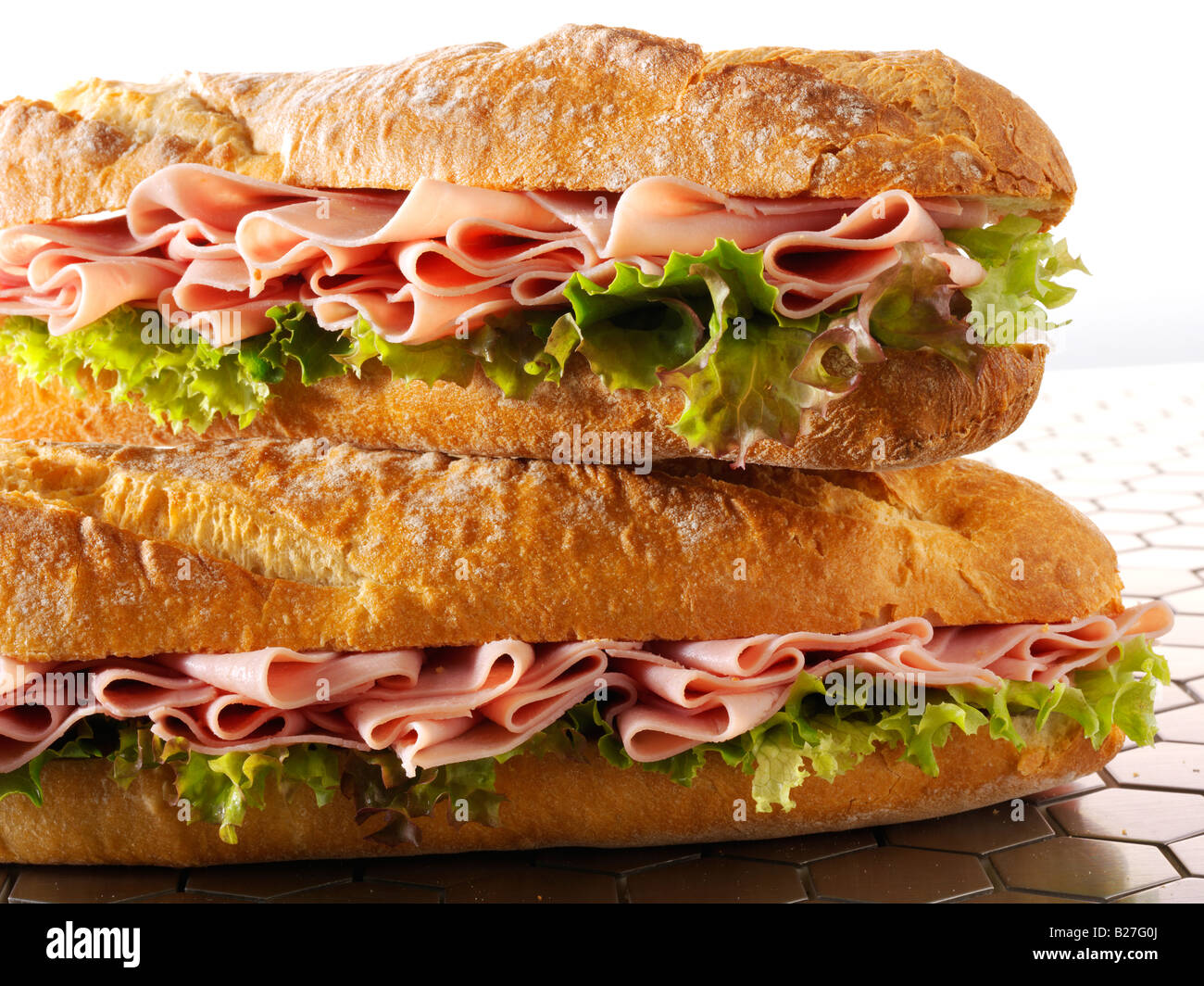 close up of  ham and lettuce baguette in french bread stick Stock Photo