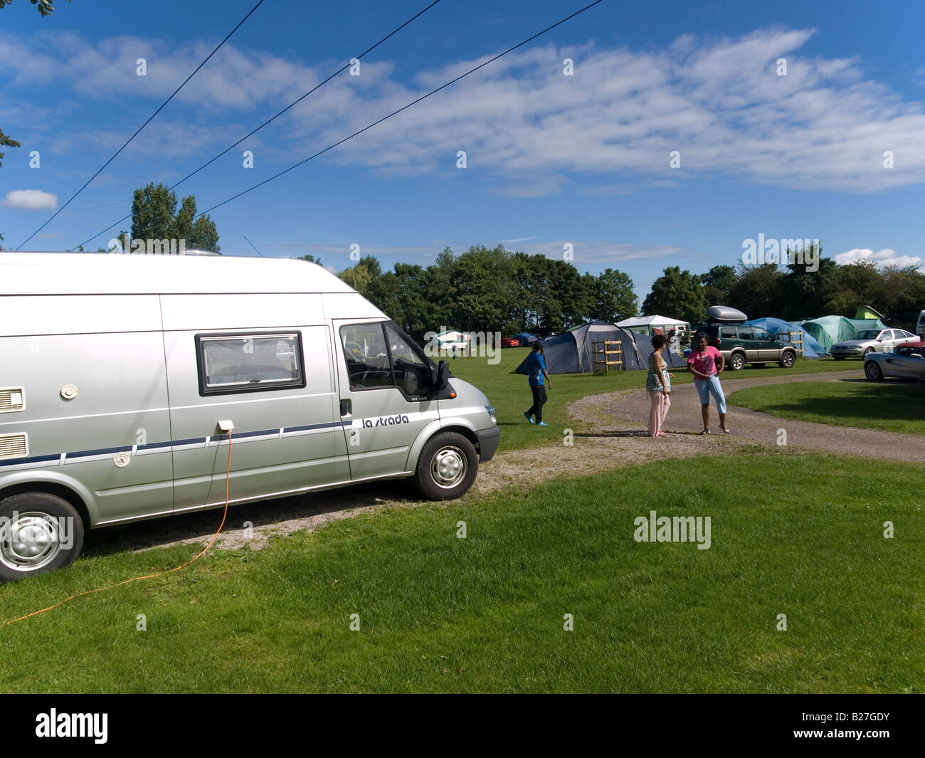 A campsite with motor caravan and tents in Nottinghamshire England Stock Photo