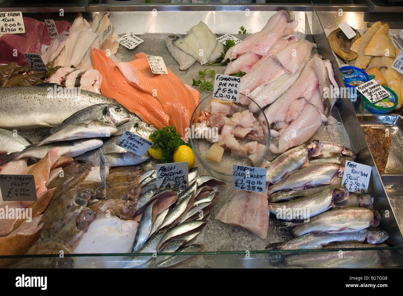A display of freshly caught fish at a fishmongers in Hastings Old Town Sussex UK Stock Photo