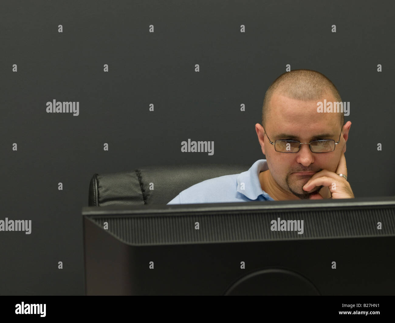 Mid adult man working at the computer Stock Photo Alamy