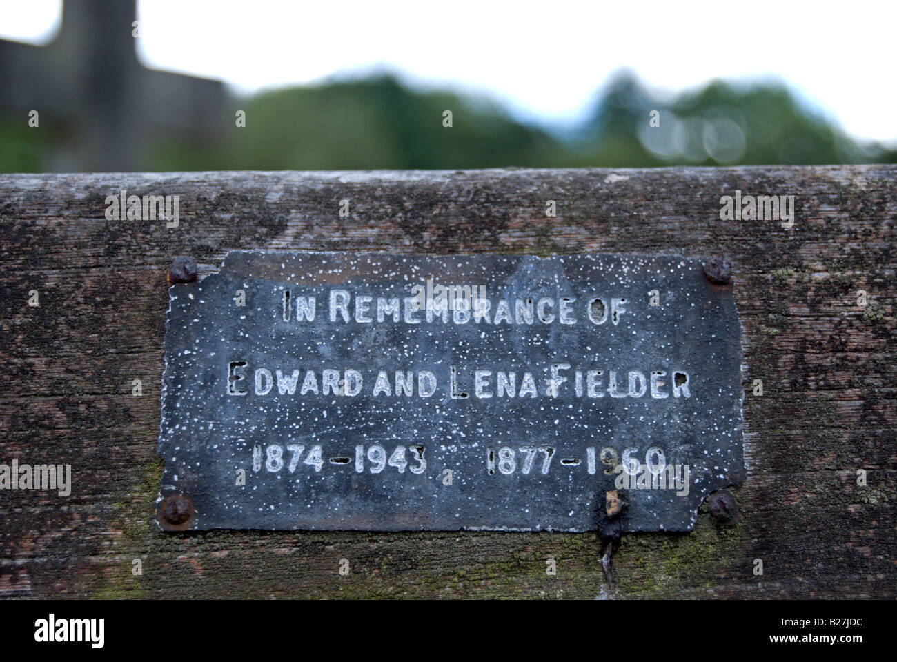 Weathered Inscription On A Memorial Bench Iin East Sheen Cemetery