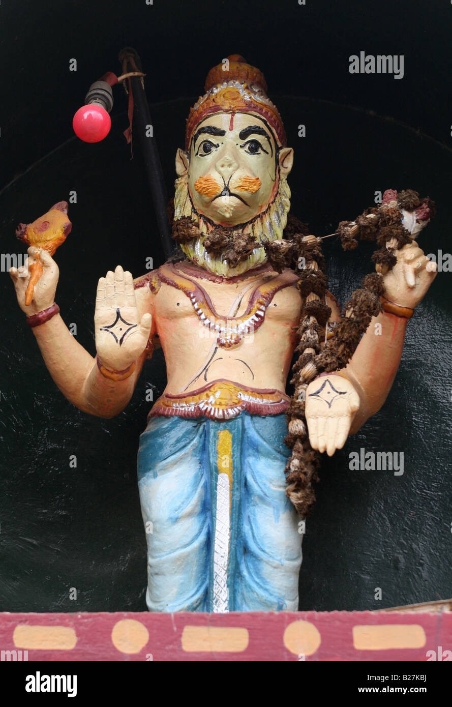 Simple Hindu temple tower statue of Narasimha an avatar of the Hindu god Vishnu , South India Stock Photo