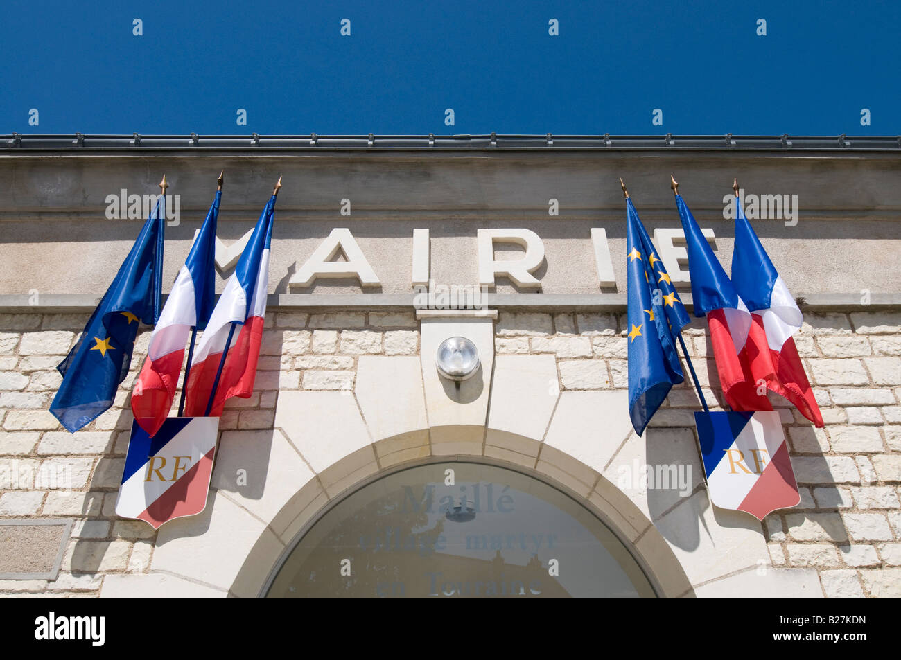 Tricolours and EU flag outside Mairie (town hall), Maillé, Indre-et-Loire, France. Stock Photo