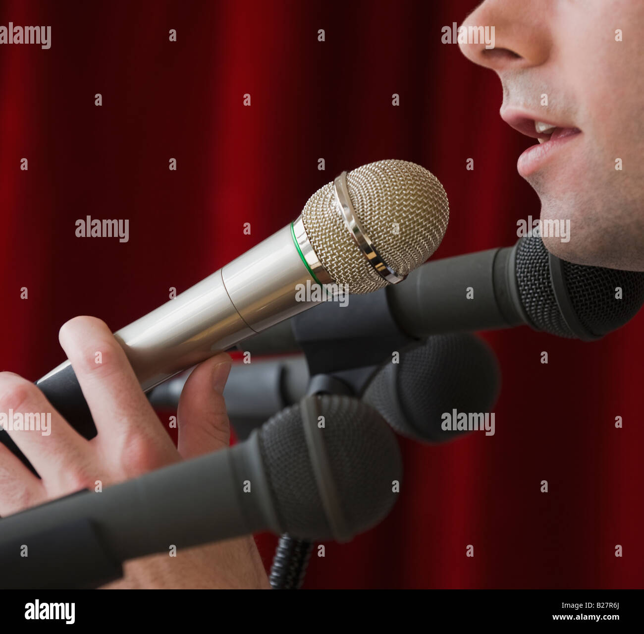 Man speaking into microphone Stock Photo Alamy