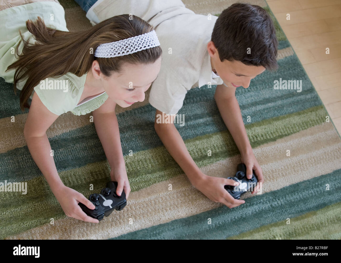 Brother and sister playing video games Stock Photo