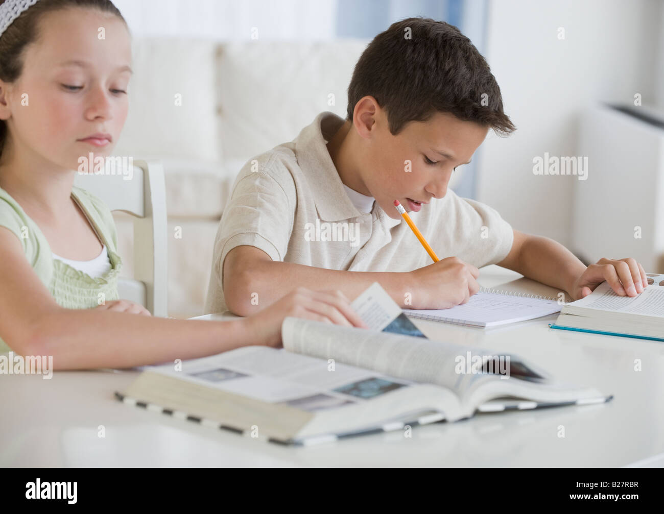 Brother and sister doing homework Stock Photo