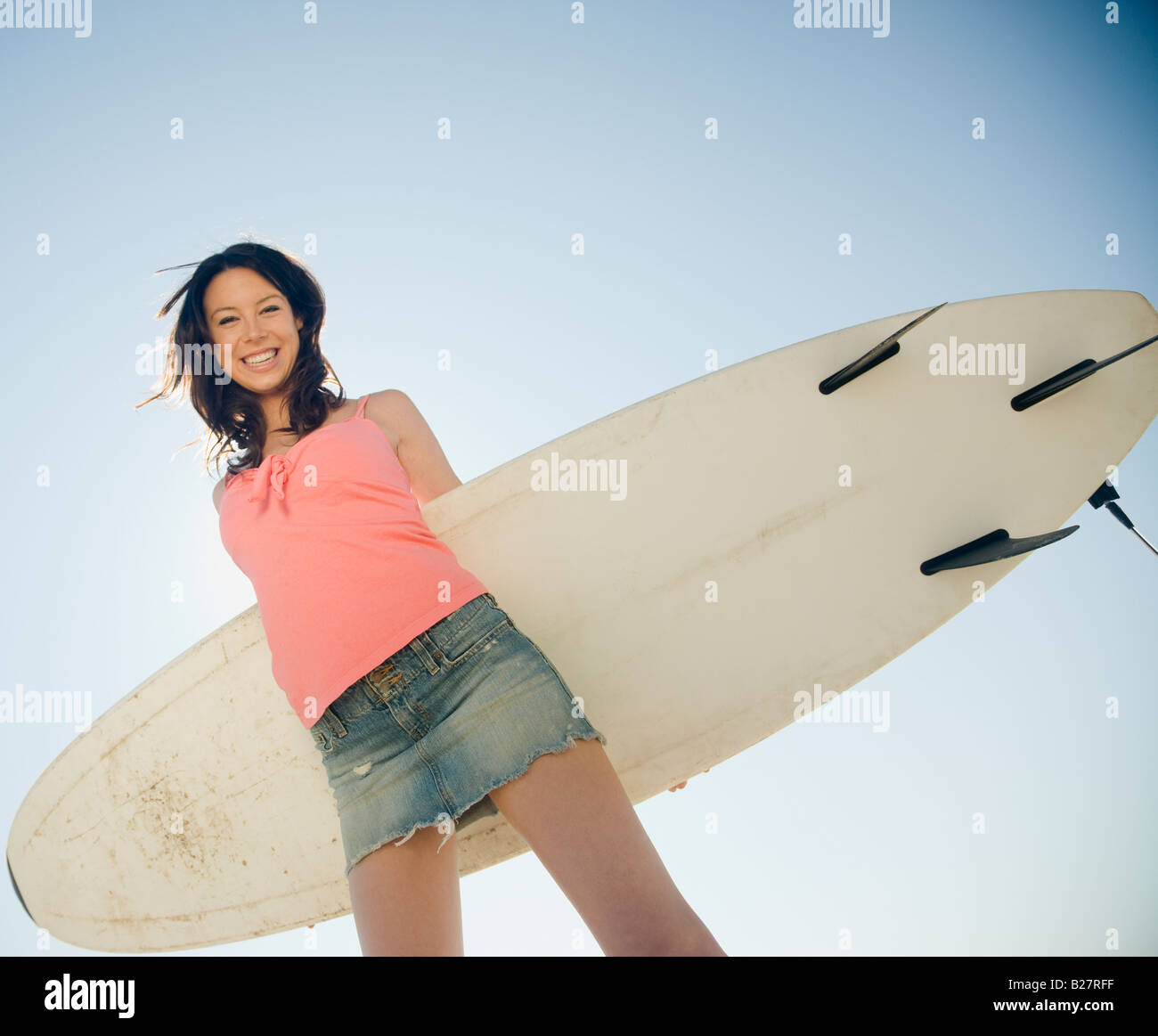 Woman holding surfboard Stock Photo - Alamy