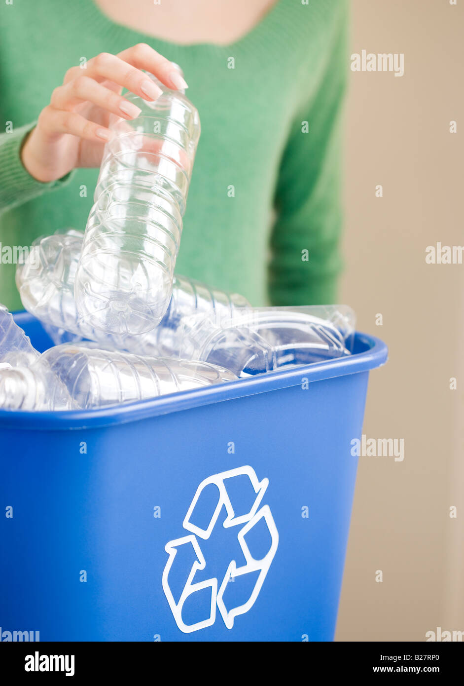 Woman filling green recycling bin hi-res stock photography and images ...