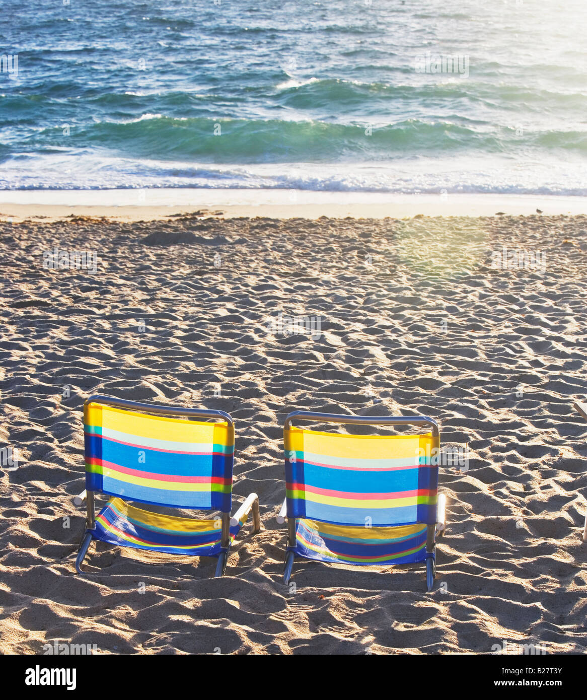Empty beach chairs on sand Stock Photo Alamy