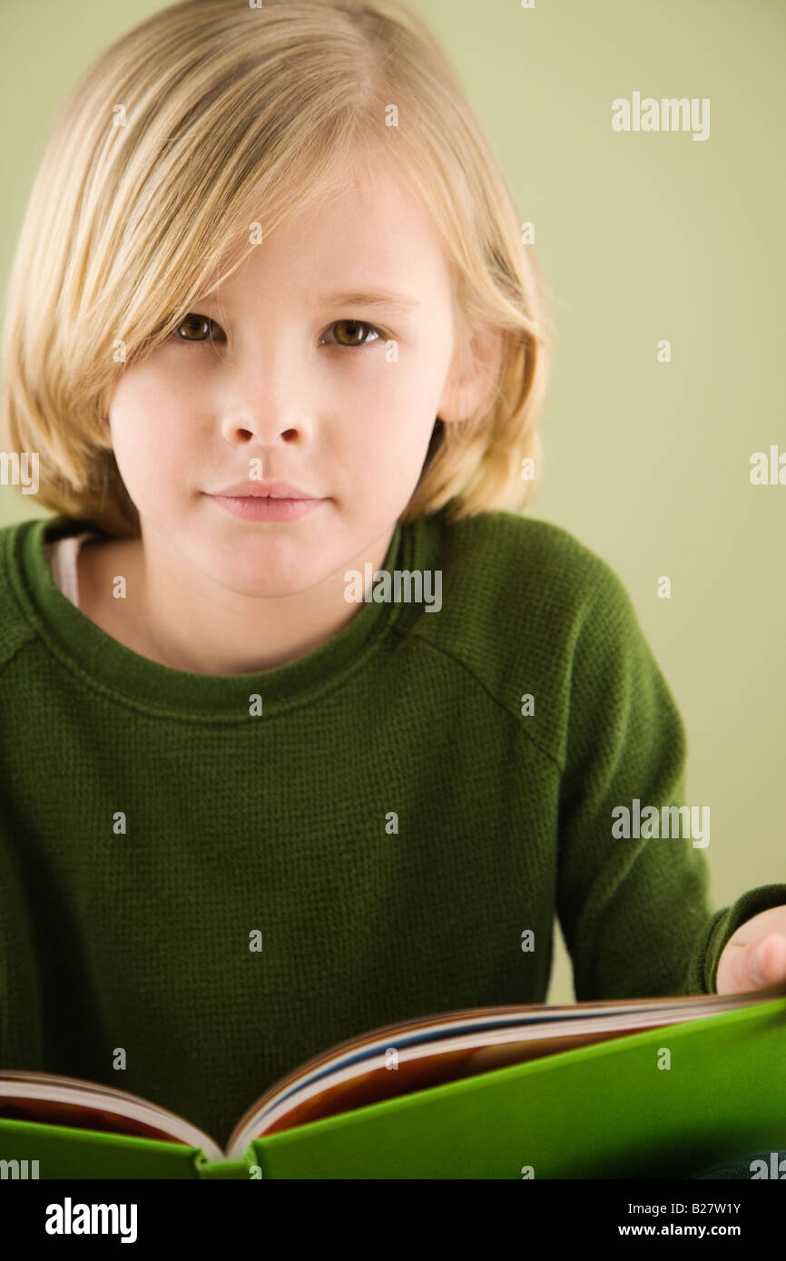 Boy holding book Stock Photo Alamy