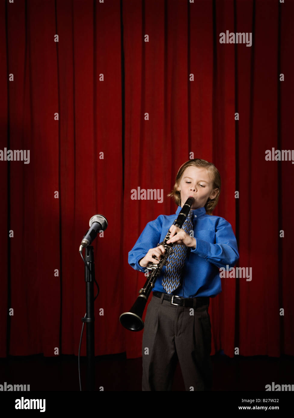 Boy playing on stage Stock Photo Alamy