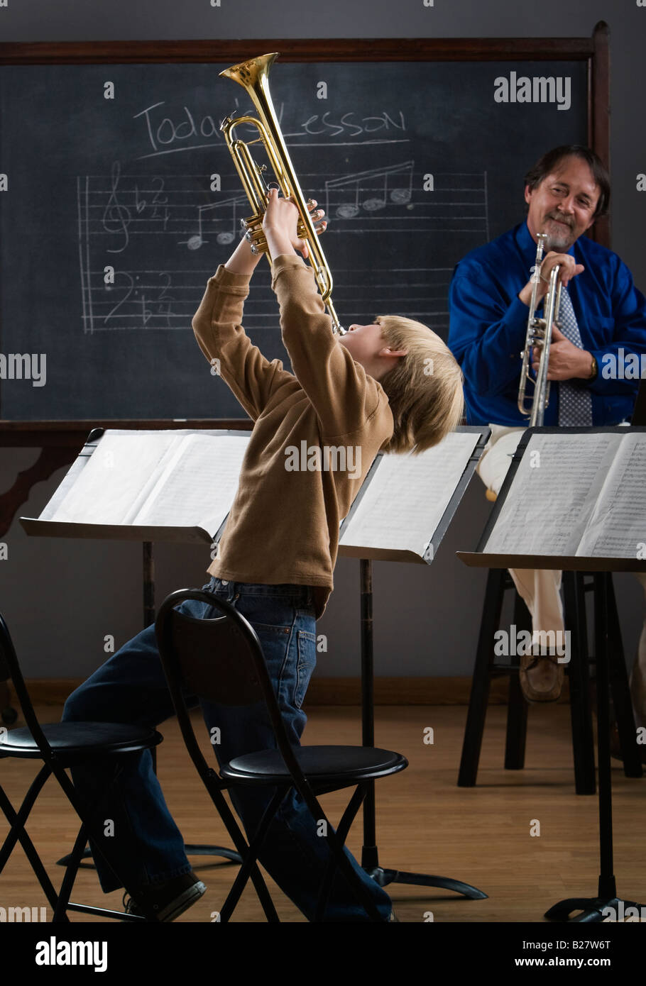 Boy Playing Trumpet In Classroom Stock Photo Alamy   Boy Playing Trumpet In Classroom B27W6T 