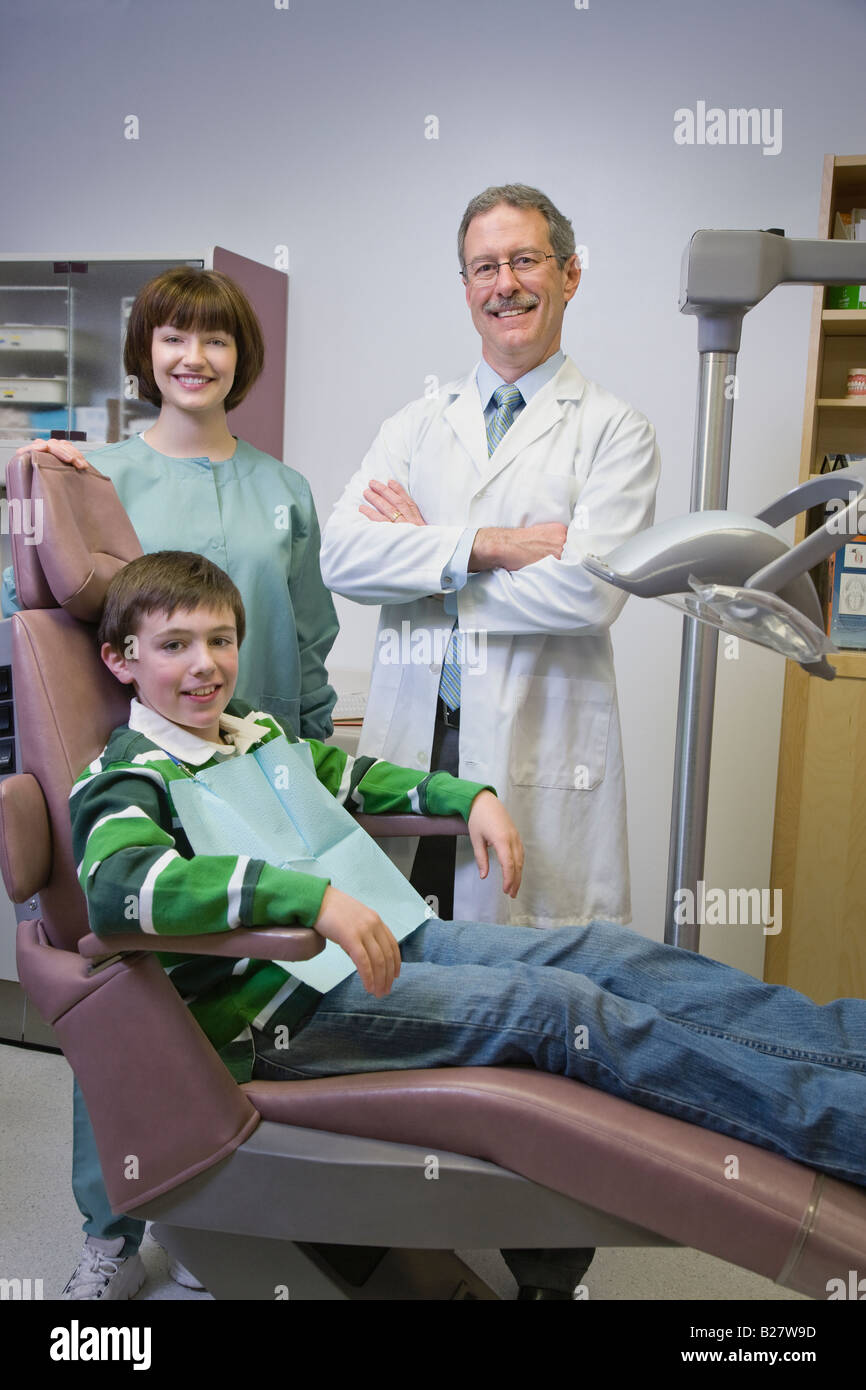 Dentist and dental hygienist with patient Stock Photo Alamy