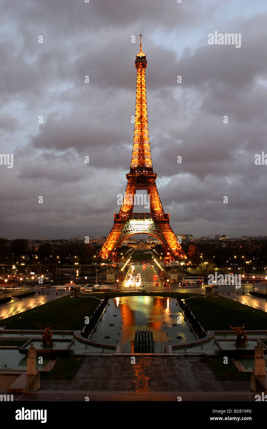 The Eiffel Tower lit up at dusk in Paris France Stock Photo - Alamy