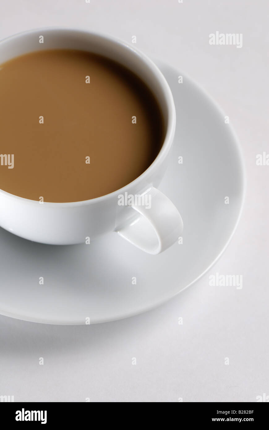 Cup of Coffee in white cup and saucer on white background Stock Photo ...