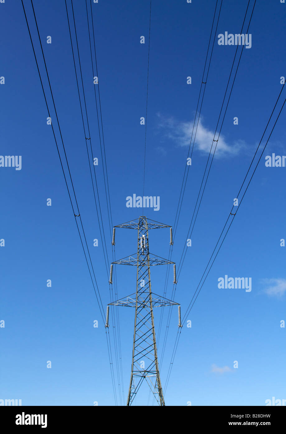 Electricity pylon against blue sky Stock Photo - Alamy