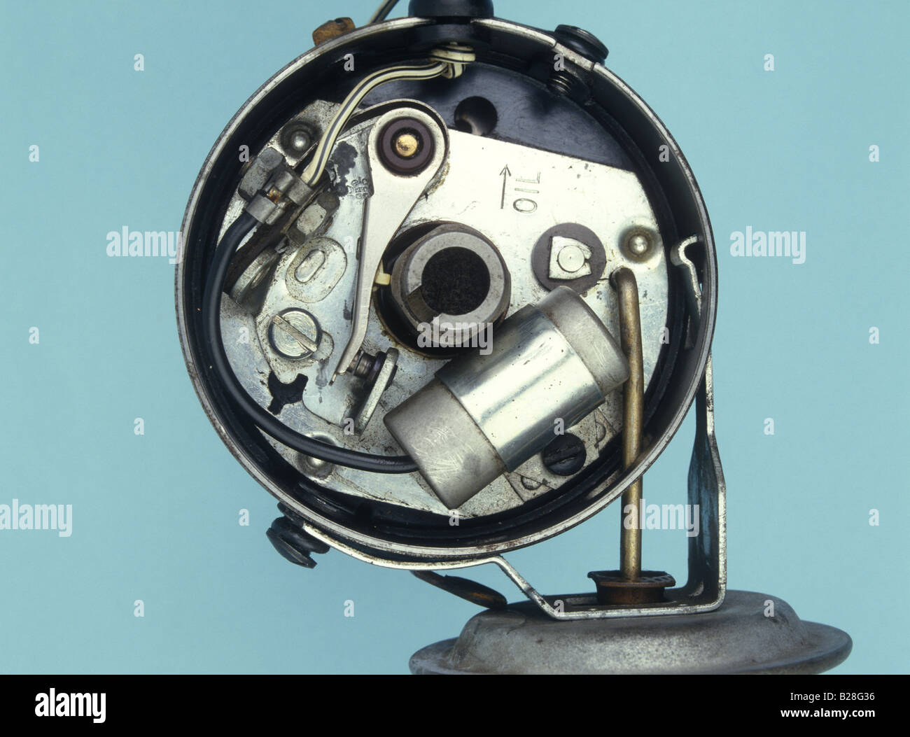 Inside of a distributor from a petrol engine showing contact breaker