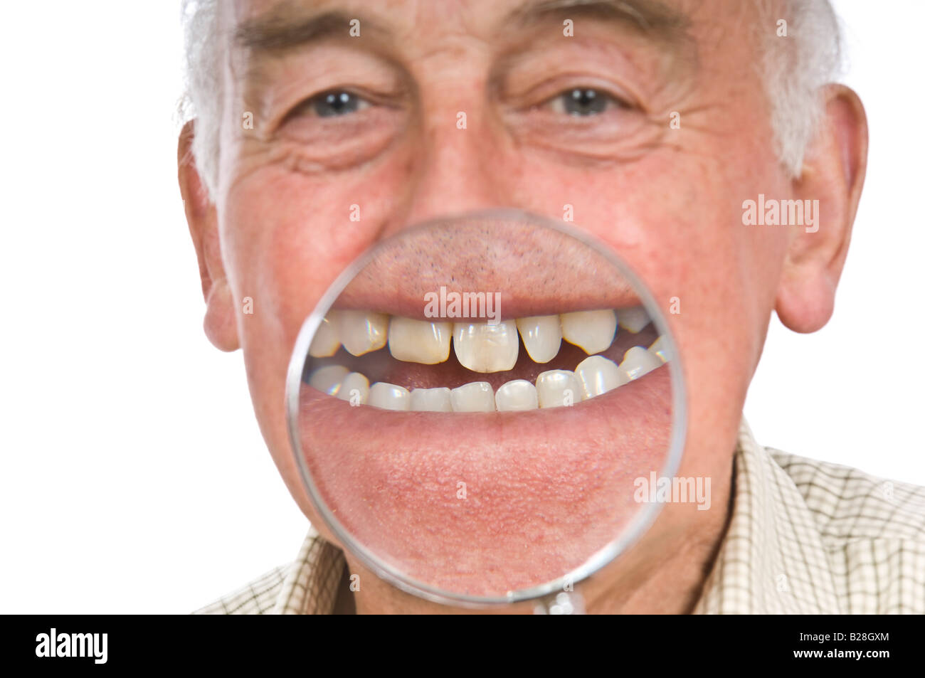 A comical image of an elderly man with a magnifying glass to enlarge his mouth against a pure white (255) background. Stock Photo