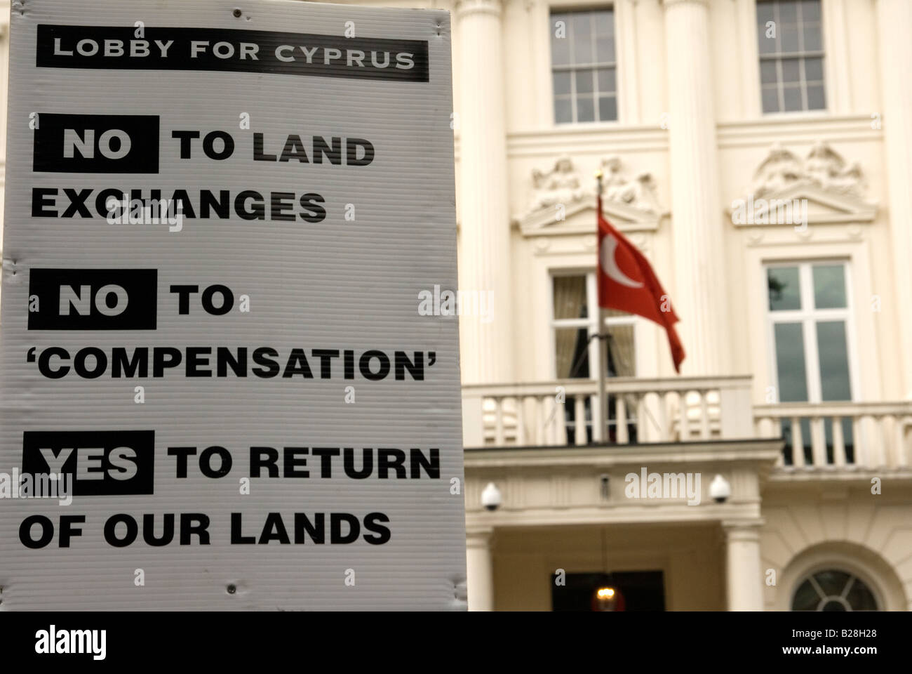 Cypriots outside Turkish Embassy in Belgave Square London on 34th anniversary of Turkish invasion into Cyprus Stock Photo