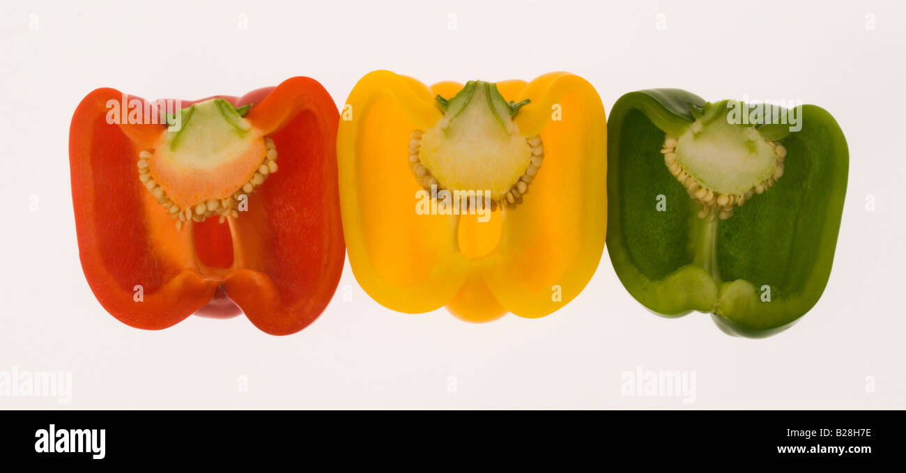 Halved yellow  red green  bell pepper capsicum annum Stock Photo
