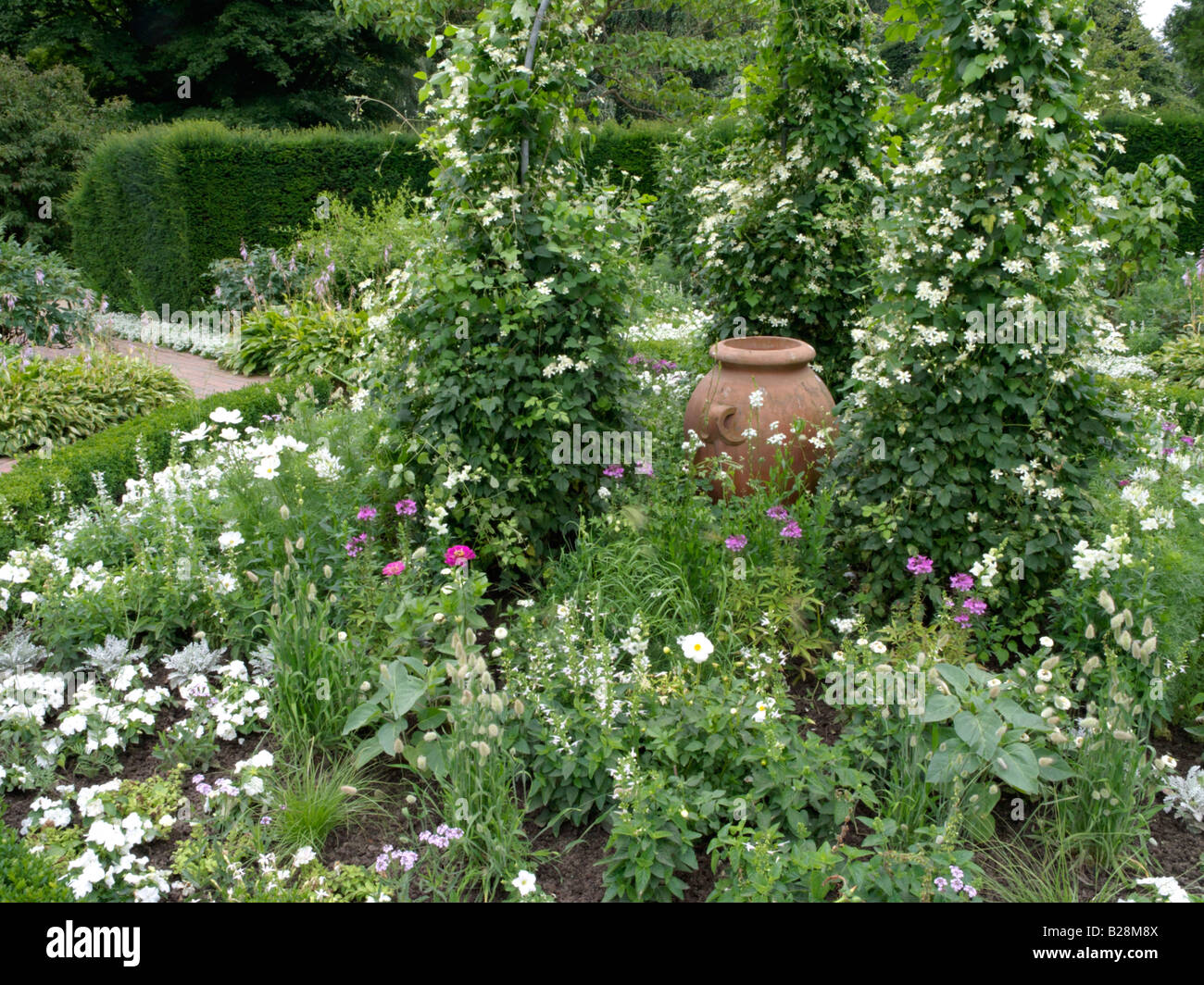 White garden with clay vase Stock Photo