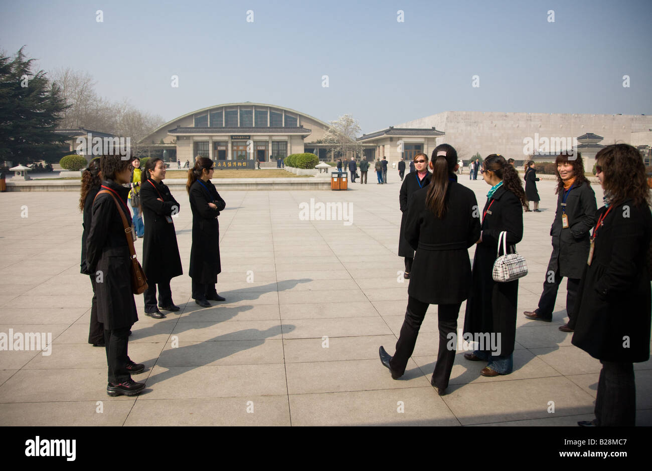 Tour guides gather outside the Qin Museum exhibition halls of Terracotta Warriors Xian China Stock Photo