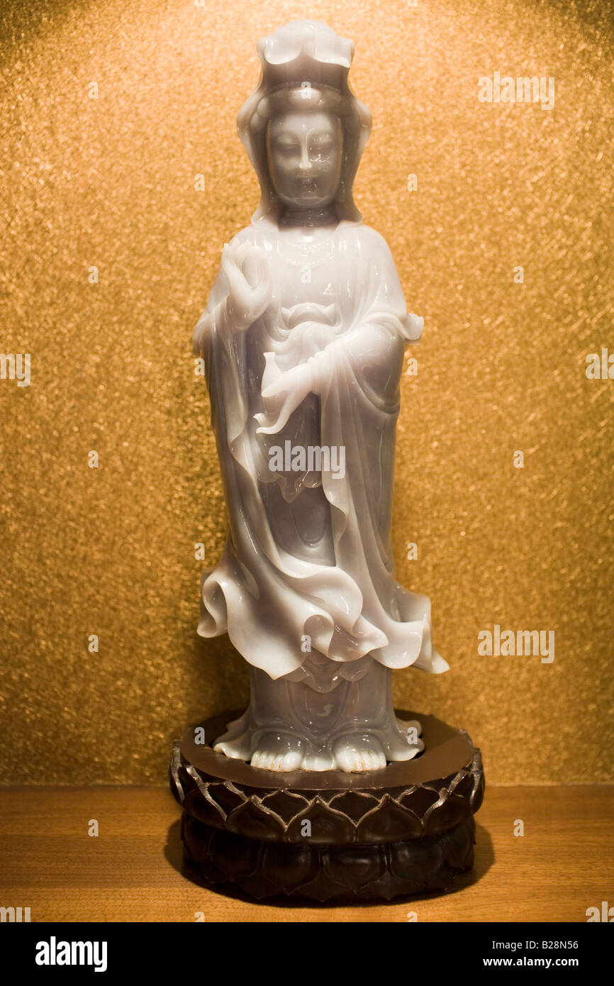 Lavender jade Goddess of Mercy figurine on display in the Huahui Jade