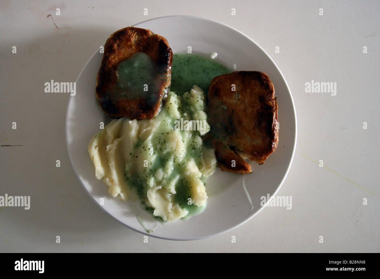 Pie and mash with parsley liquor Stock Photo Alamy