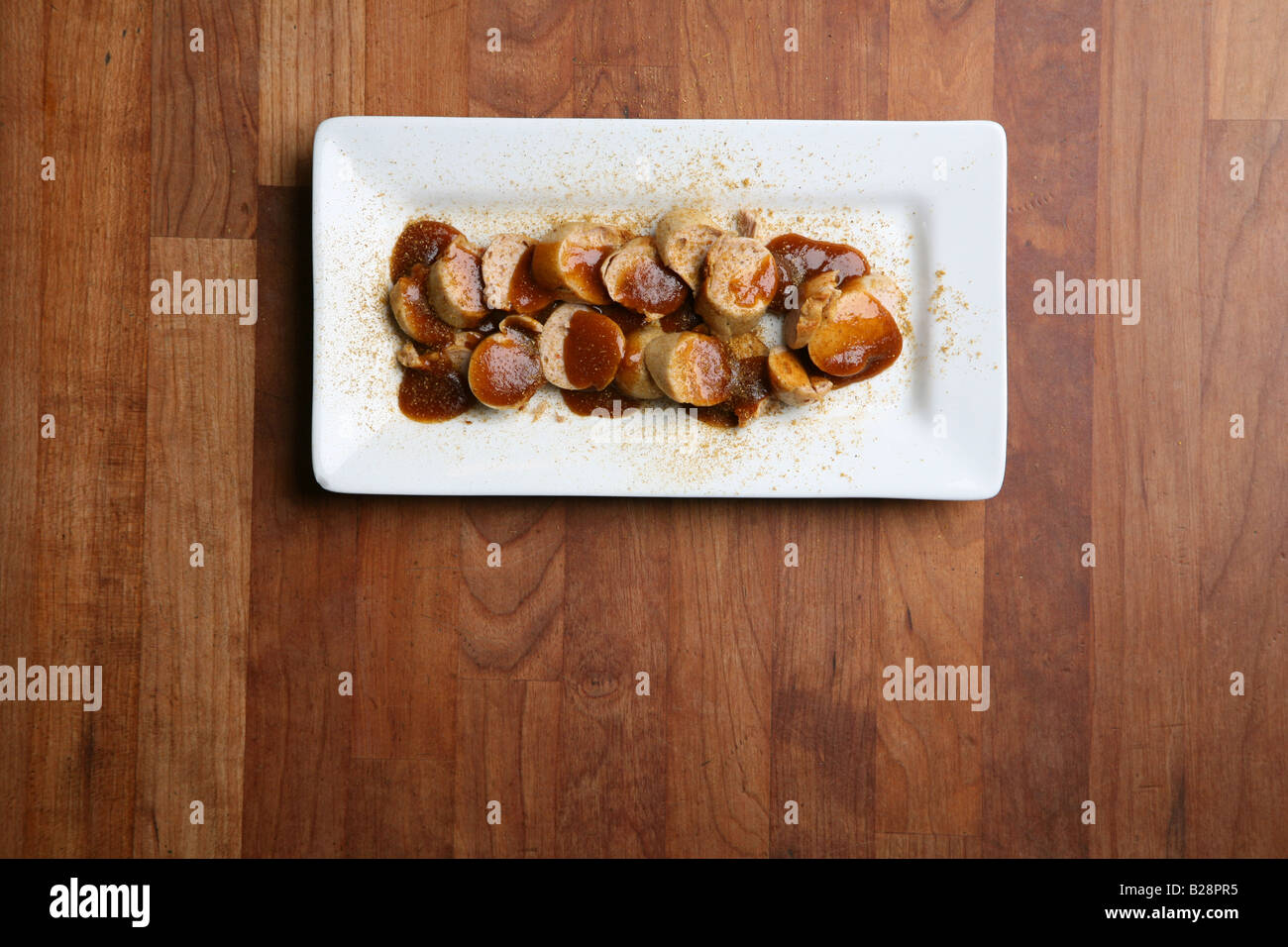 Currywurst german sausage on a plate Stock Photo