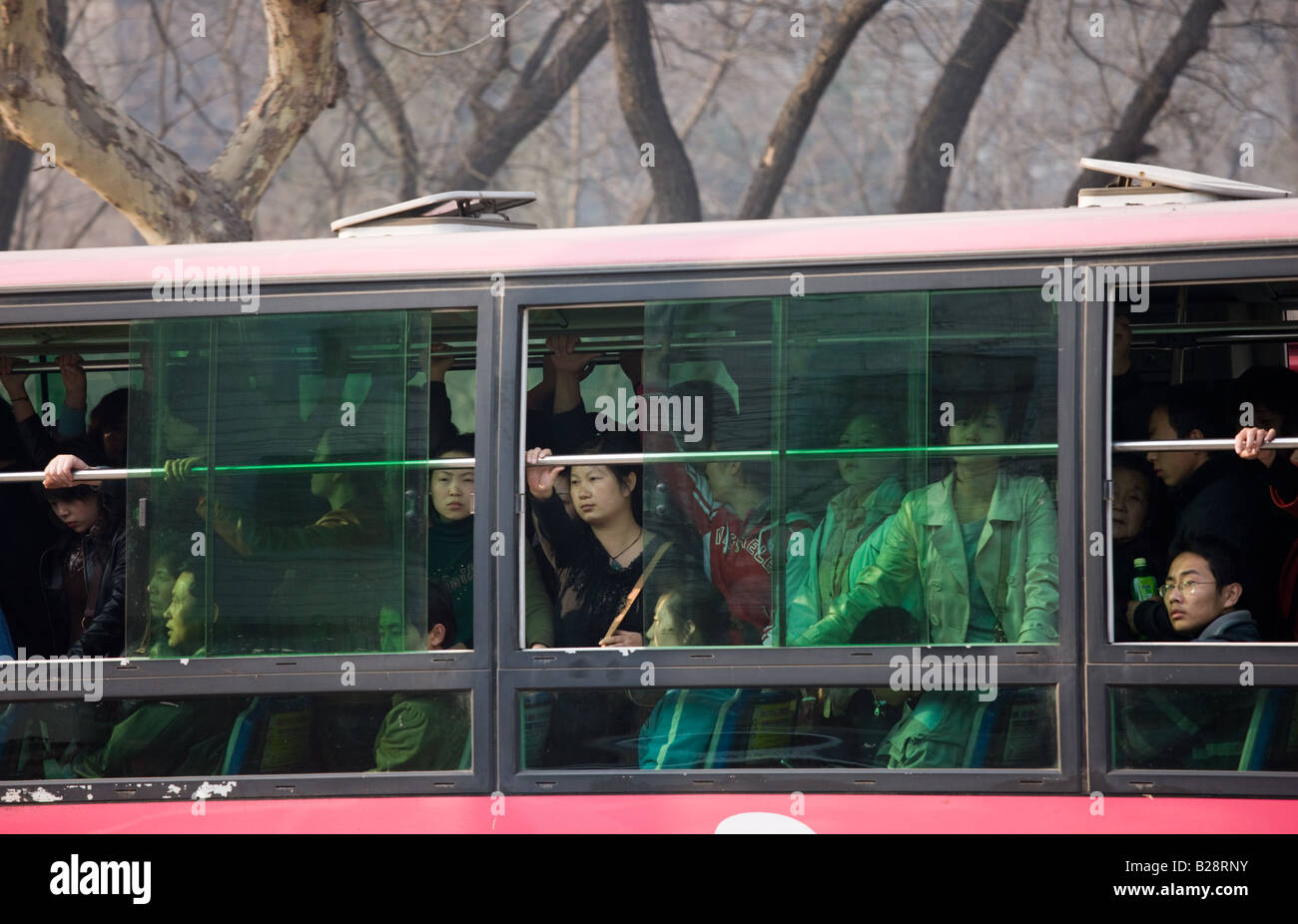 Bus carries workers home in rush hour Xian city centre China Stock Photo