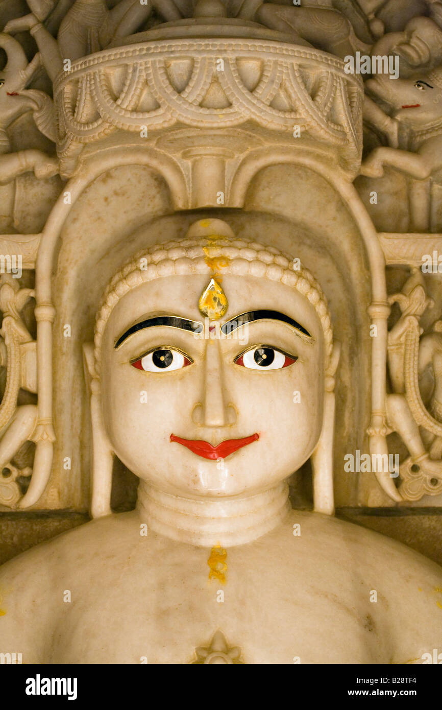 A hand carved WHITE MARBLE statue of MAHAVIRA in a JAIN TEMPLE inside JAISALMER FORT RAJASTHAN INDIA Stock Photo