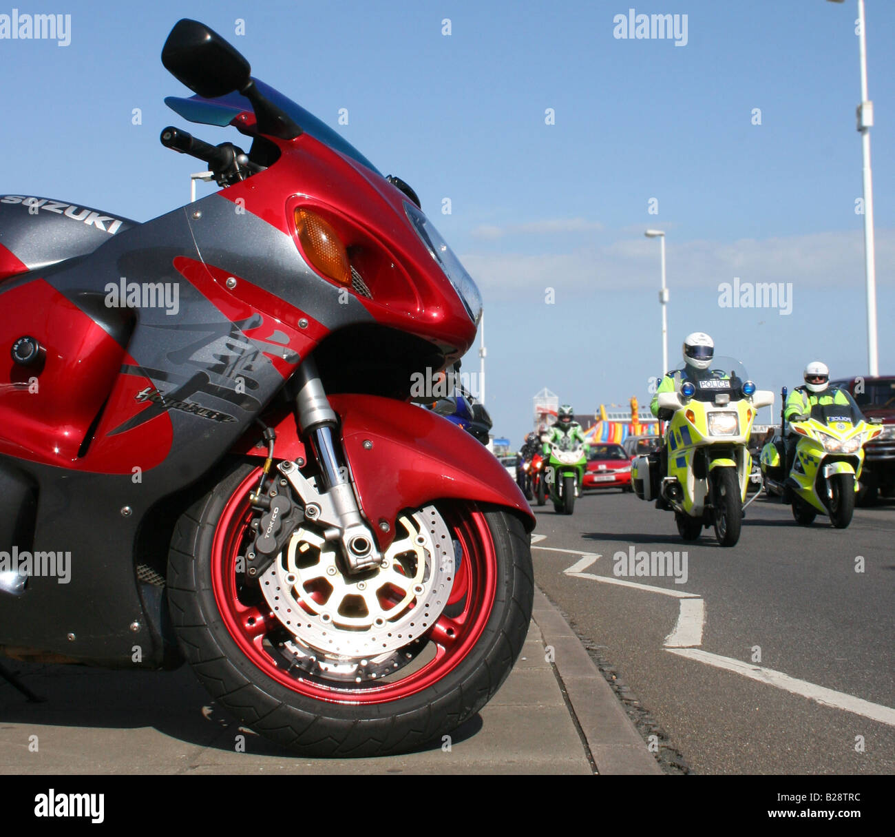 The Suzuki Hayabusa GSX1300R hyper sport motorcycle and police motorcycles at Hastings May Day bike festival Sussex England Stock Photo