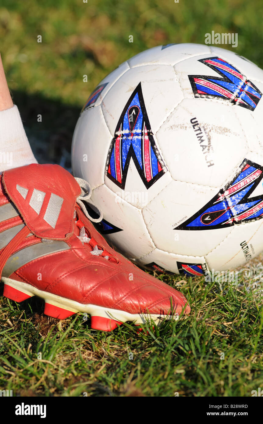 Football player kicking the ball Stock Photo Alamy