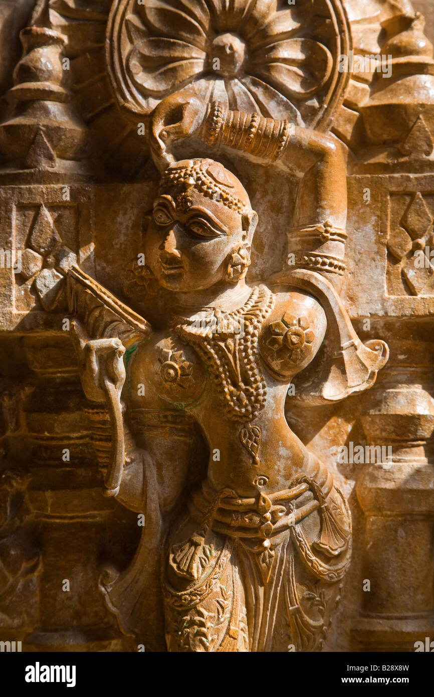 A hand carved SANDSTONE FEMALE ANGEL in the CHANDRAPRABHU JAIN TEMPLE inside JAISALMER FORT RAJASTHAN INDIA Stock Photo