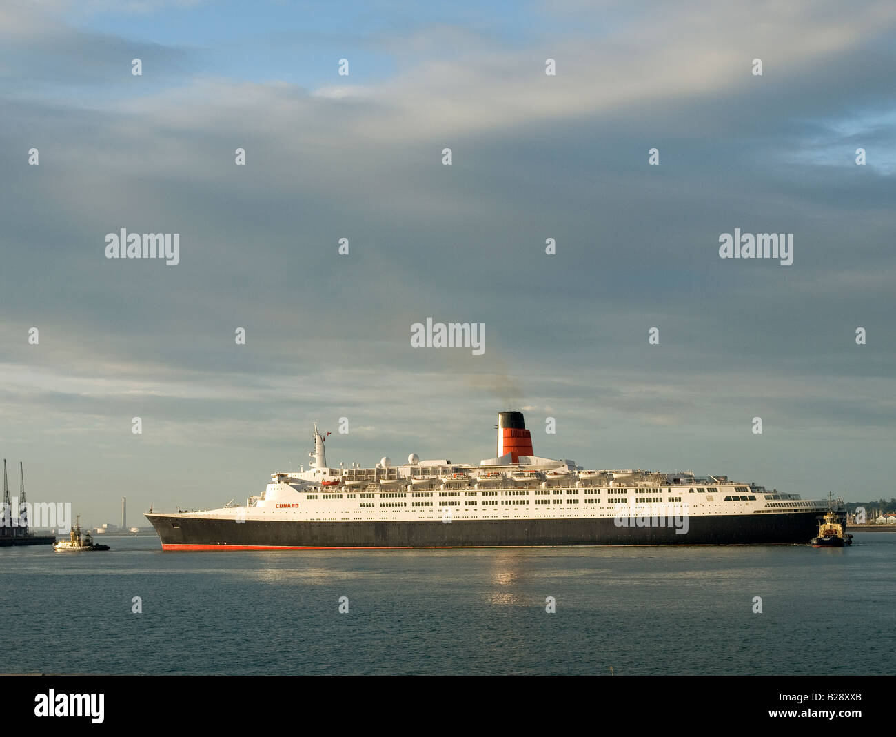 Cunard ocean liner Queen Elizabeth 2 arriving at her home port of Southampton UK early morning