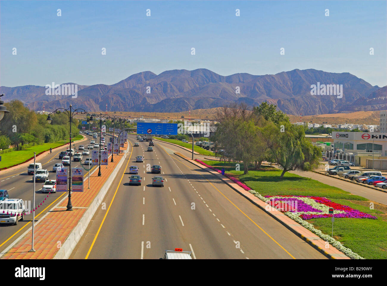 Route One in Muscat looking East towards mountains Stock Photo