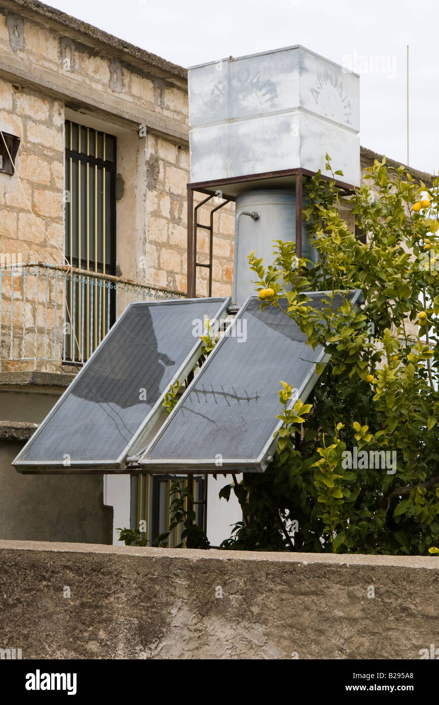 A small scale domestic solar water heating unit outside a house in the village of Drouseia, Cyprus Stock Photo