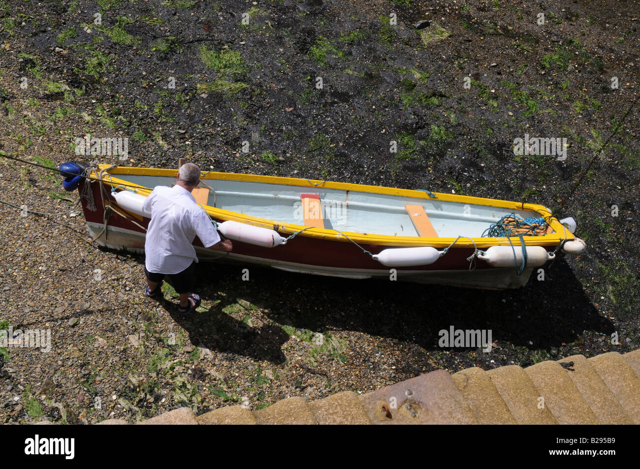 Boatman prepares his boat Stock Photo